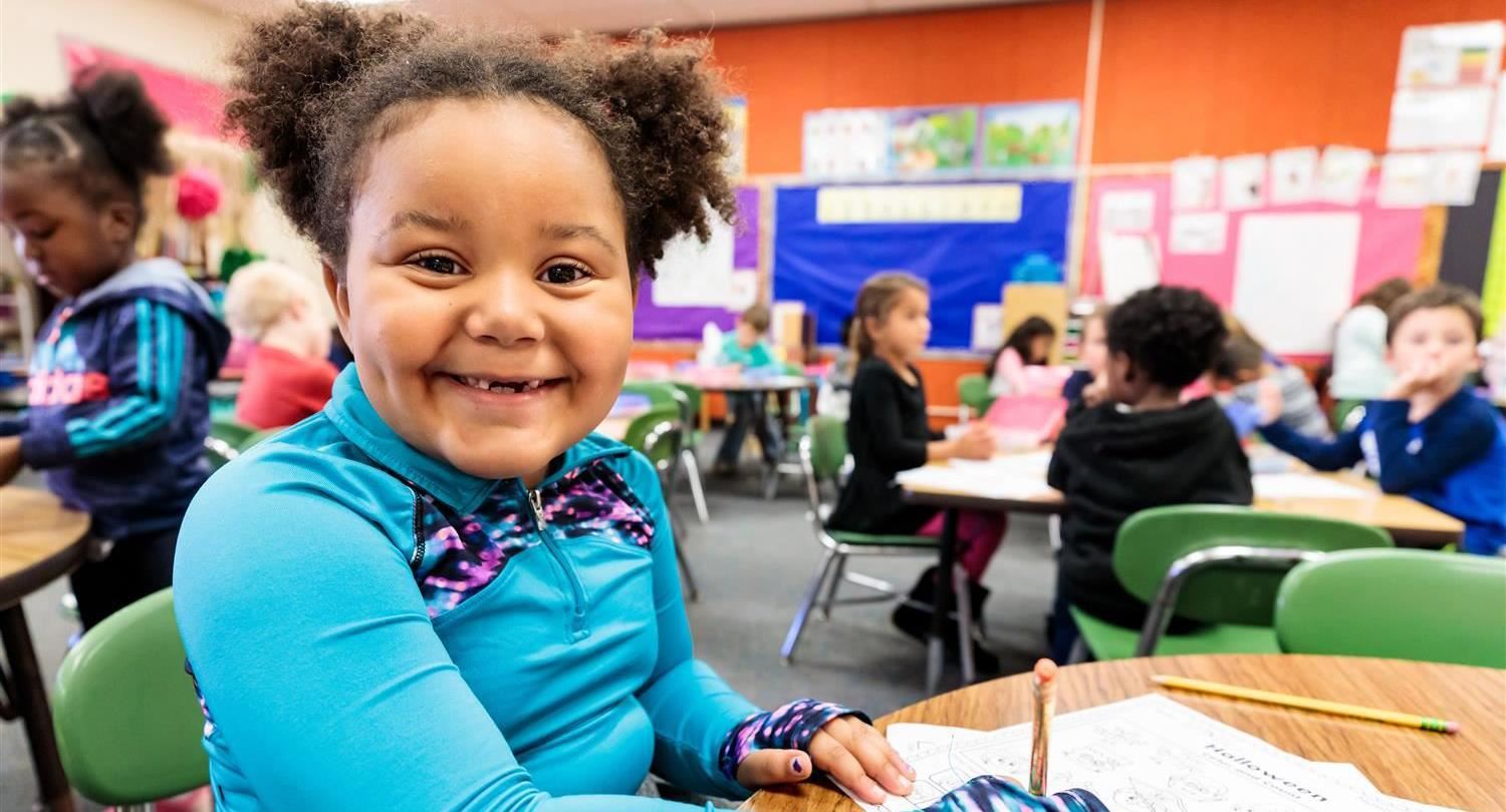Kindergarten student smiling 
